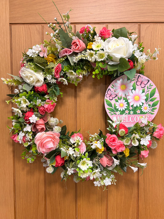 Artificial wreath with welcome sign